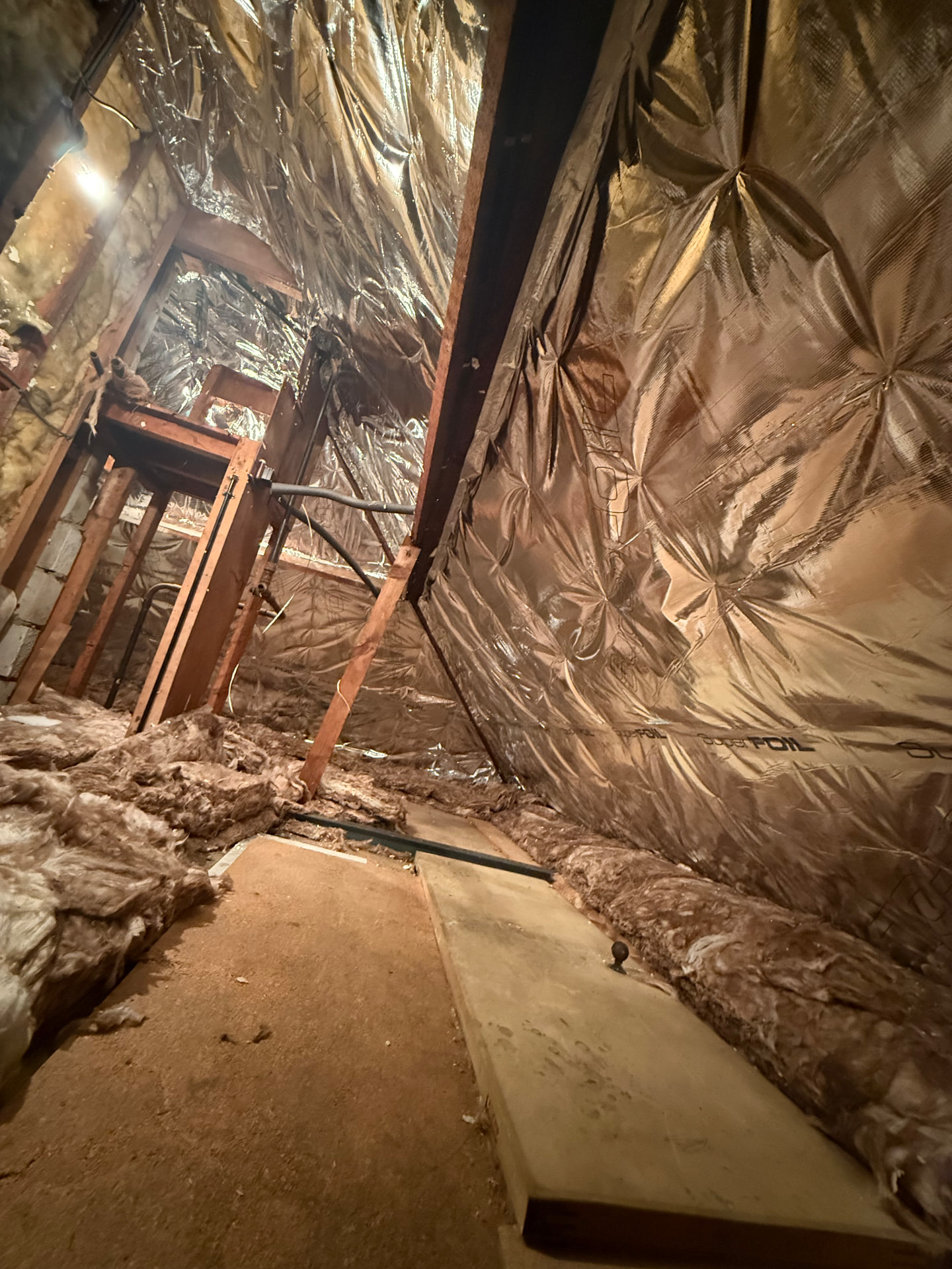 Finished SuperFOIL SF19+ multifoil insulation fitted across a loft roof slope by LoftServ Energy