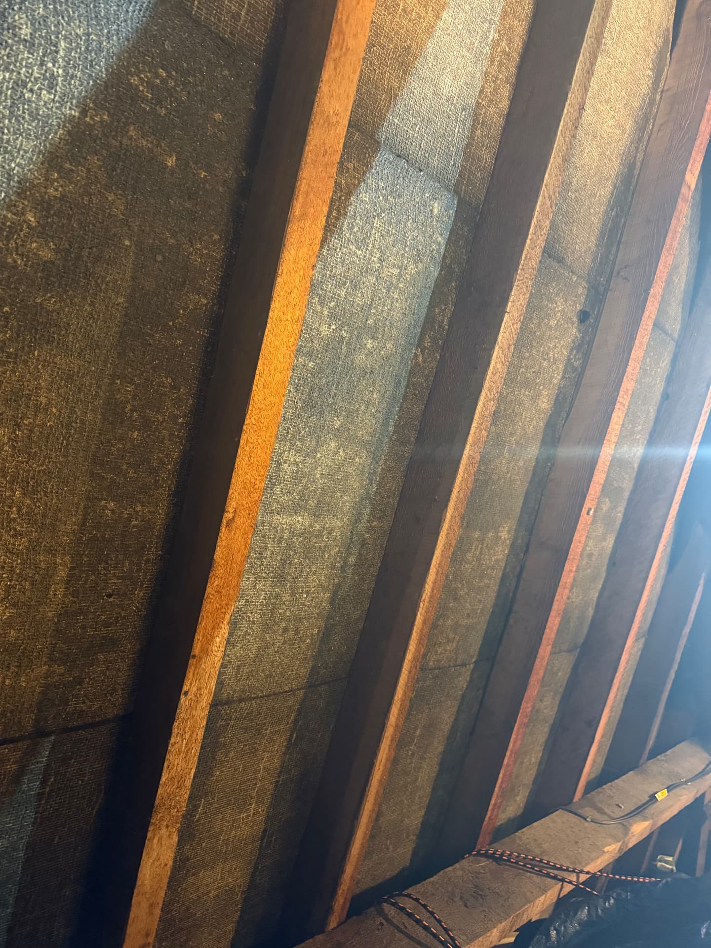 Loft rafters before SuperFOIL SF19+ installation — bare roof and no insulation fitted